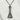 Kobe Port Tower Pendant, oxidized silver, front view on white stone pedestal