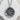 Japanese peace kanji pendant, oxidized silver finish on textured stone surface