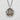 Flat lay view of handcrafted Japanese kanji pendant displaying intricate 14K gold vermeil symbol on sterling silver