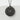 Cherry Blossom Pendant, black rhodium, front view on stone surface