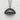 Close-up of the solid silver dumpling pendant emphasizing the deep oxidation and polished half-moon crescent body.