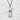 Frontal view of the sterling silver connection kanji pendant resting on a textured light stone background.