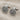 Pair of historical Hittite seal cufflinks resting on textured linen fabric, highlighting the 925 silver toggle closure.