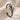 Close-up of dark oxidized stag antler ear cuff highlighting the elegant curved cartilage wrap design