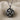 Close-up of the handcrafted Phrygian knot pendant revealing polished silver strands and deep oxidation