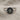 Close-up of two-tone handcrafted Hittite sun ring resting on textured linen revealing dark patina and polished band