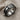 Teshub lightning ring, oxidized, angled view on neutral fabric