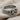 Detailed close-up of the oxidized silver Gordian knot ring resting on a textured fabric showcasing the deep woven recesses.