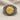 Lydian Lion Coin Ring, two-tone finish, front view on fabric