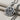 Close-up angled view of the handcrafted Peace Love Pendant highlighting the intricate textured silver detailing.