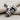 Grip Barbell Pendant, oxidized silver, angled close-up view