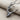 Detailed close-up of 925 sterling silver ballet dancer pendant resting on fabric highlighting the tutu design