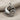 Close-up of the handcrafted dolphin wave pendant showing intricate wave details and oxidized 925 silver finish.