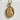 Gold vermeil St Michael guardian angel medal pendant resting on white stone texture under bright sunlight
