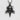 Close-up of handcrafted skull cross pendant showing intricate oxidized silver metalwork on a textured white surface.