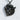 Woodland Moose Pendant, black rhodium, front view against textured wall
