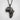 Africa Map Lion Pendant, black rhodium, product photo on white stone