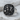 Close-up of the handcrafted Hercules signet ring resting on textured stone highlighting the oxidized silver