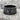 Si Vis Pacem Swords Ring in black rhodium, front view on stone surface