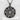 Close-up of floral pentacle pendant displaying intricate oxidized silver vines and rose details on a textured surface
