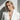 Fashionable woman in a white blazer showcasing the handcrafted 925 silver crescent moon pendant necklace.