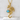 Detailed dragon necklace holding a vibrant blue opal sphere resting elegantly on a textured white stone display