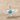 Farvahar Drop Earring, polished silver, front view on sand