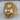 Anubis Skull Ring, gold vermeil, product photo on wood surface