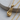 Laced Boxing Glove Pendant, gold vermeil, product photo on wood