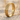 Celtic Heart Knot Ring, gold vermeil, product photo on sand