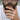 Bearded man wearing an oxidized silver dragon eye signet ring on his finger in a stylish lifestyle close-up
