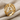 Web Dome Ring in gold vermeil, angled view on fabric