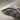 Close-up detail of textured feather engraving and pave set stone accents on oxidized silver angel wing ring