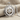 North Star Compass Pendant, polished finish, front view on stone block