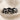 Lucky Elephant Ring, black rhodium plated, front view on linen