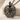 Ribcage Bud Pendant, black rhodium plated, product photo on stone surface