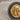 Lydian Lion Coin Earring, two-tone, close-up of lion face relief