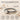Sterling silver pearl stacking ring features genuine freshwater pearl on beach sand with shells