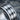 Industrial Riveted Plate Ring, oxidized, close-up of riveted panels