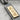Bushido Kanji Bar Pendant angled close-up showing engraved calligraphy detail