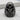Atlas Rise Ring, black rhodium, front view on stone surface
