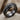 Two Row Cable Ring, black rhodium, product photo on textured fabric