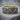 Camel caravan band ring, two-tone finish, front view on stone