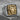 Lion Head Signet Ring, two-tone, product photo on stone