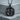 Twin Horses Pendant, black rhodium, front view on concrete block