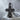 Eastern Orthodox Cross Pendant, black rhodium finish, product photo on stone