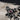 Garnet Double Gothic Cross Ring, oxidized silver, close-up of bezel-set garnet and filigree cross