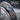 Blue Topaz Crest Spinner Ring, oxidized silver, close-up of blue topaz and crest