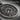 Bear and Fish Medallion Pendant in oxidized silver, close-up of bear relief