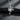 Handcrafted silver religious angel pendant with assault rifle weapon detail for streetwear style